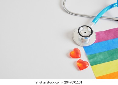 Medical Stethoscope, Little Red Hearts And Lgbtq Community Flag On Gray Background Copy Space, Individual Approach In Medicine Concept, Unconventional Love And Artificial Insemination