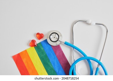 Medical Stethoscope, Little Red Hearts And Lgbtq Community Flag On Gray Background Copy Space, Individual Approach In Medicine Concept, Unconventional Love And Artificial Insemination