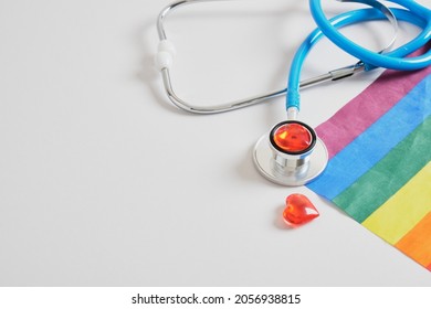 Medical Stethoscope, Little Red Hearts And Lgbtq Community Flag On Gray Background Copy Space, Individual Approach In Medicine Concept, Unconventional Love And Artificial Insemination