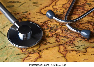 Medical stethoscope over Europe healthcheck. Medical concept tourism travel care diseases healthy, close-up. Stethoscope on map background with copy space, top view, selective focus. 