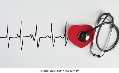 Medical stethoscope and red heart with cardiogram isolated on white. Cardiac therapeutics assistance, pulse beat measure document, arrhythmia pacemaker medical healthcare concept - Shutterstock ID 709639459