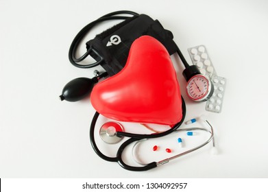 Medical Stethoscope With Red вalloon Heart On White Background. Medical Concept. February National Heart Month