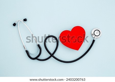 Medical stethoscope and red heart, top view. Health care and heart check concept.