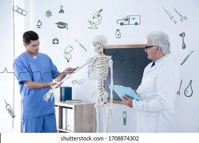 Medical student and professor studying human skeleton anatomy in classroom - Powered by Shutterstock