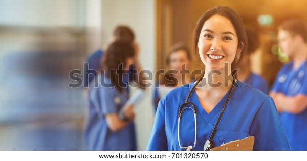 Medical student\
smiling at camera in\
university