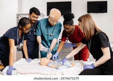 Medical students in scrubs practice CPR on a baby mannequin during a training session. - Powered by Shutterstock