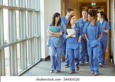 Medical students walking through corridor at the university