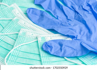 Medical surgery masks and a nitril glove close up with selective focus, - Shutterstock ID 1702550929