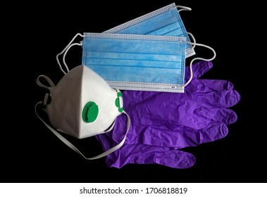 Medical Surgical Mask, N95 FFP3 Face Masks And Latex Gloves For Protection Against Diseases, Virus, Flu, Coronavirus COVID-19 Or Pollution. Personal Protective Equipment PPE On A Black Background.