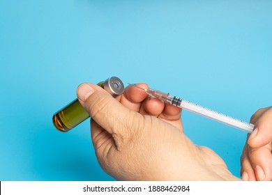 Medical syringe in solid color background - Shutterstock ID 1888462984