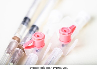 Medical Syringes And Cannula. Hospital Treatment Accessories. Light Background.