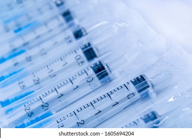 Medical Syringes In A Package. Medical Syringes In Packaging As An Abstract Medical Background.