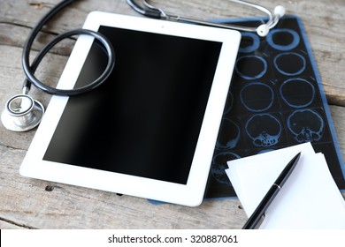 Medical Tablet With Screen Empty Screen On Wooden Table