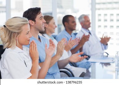 Medical Team Clapping Hands During A Conference