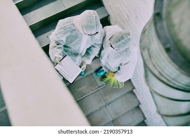 Medical team and covid hygiene healthcare professionals wearing hazmat suits for safety while working at quarantine site. Above first responders in protective gear to fight virus with innovation - Powered by Shutterstock