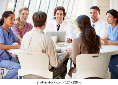 Medical Team Discussing Treatment Options With Patients - Powered by Shutterstock