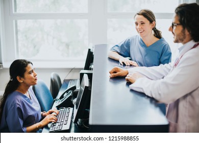 Medical Team Having A Conversation At The Reception