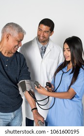 Medical Team In A Hospital Working With Their Patient