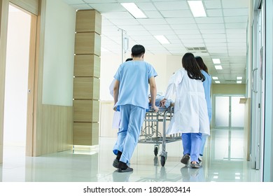 Medical team including doctor working in rush to take a patient in emergency case to operation room. - Powered by Shutterstock