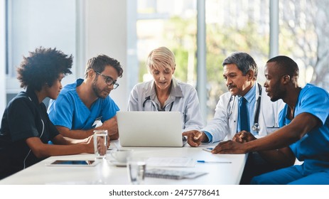 Medical team, laptop and meeting in office for healthcare, research and expertise in hospital. Men, women and feedback at table for brainstorming, consulting and problem solving in boardroom - Powered by Shutterstock