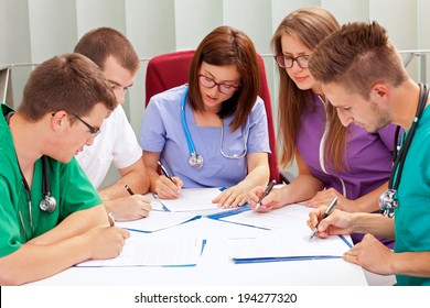 A Medical Team Meeting In The Hospitalhttp://admin.shutterstock.com/78625/review_batch.mhtml?queue_type=photo_queue&batch_url=%2Fbatches%2F1095413&code=5c89ee95382119860ddb4d481ed44b4d&account_id=1503659