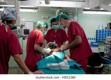 Medical Team Performing A Pediatric Surgery