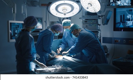 Medical Team Performing Surgical Operation in Modern Operating Room - Shutterstock ID 741433843