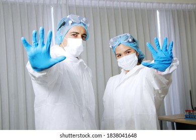Medical team in Personal Protective Equipment or PPE clothing is  Healing for patient infected with the Covid-19 virus in hospital of Thailand - Shutterstock ID 1838041648