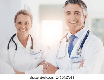 Medical team, portrait and confident in hospital for healthcare, professional and pride in lobby. Mature doctors, support and about us in corridor for cardiology, medicare and expertise in clinic - Powered by Shutterstock