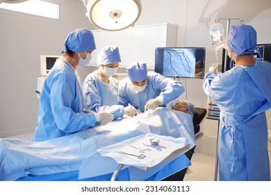 A medical team is rescuing an accident patient in the emergency room. - Powered by Shutterstock