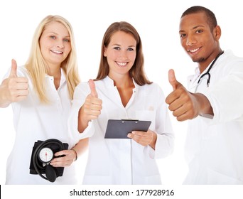 Medical Team Showing Thumbs Up. All On White Background.