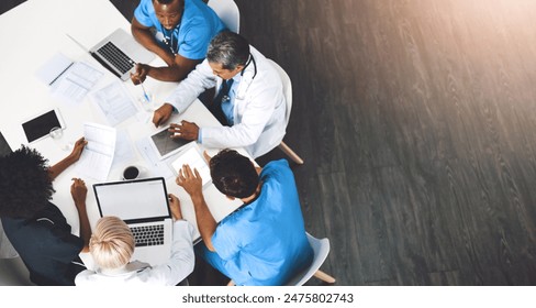 Medical team, technology and meeting in office from above, paperwork and budget in hospital. Men, women and specialist at table for brainstorming, healthcare and financial planning in boardroom - Powered by Shutterstock