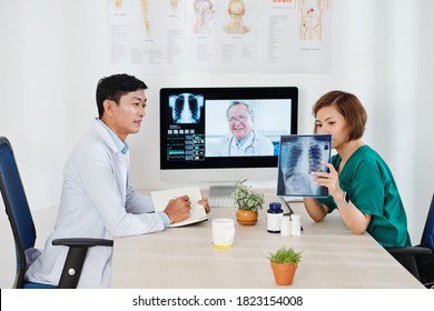 Medical Team Video Calling Experienced Oncologist To Discuss Dark Spot On Chest X-ray Of Patient