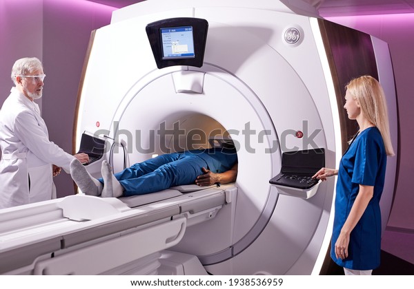 Medical technical\
assistant performing radiological scan of patient with magnetic\
resonance tomography\
MRI
