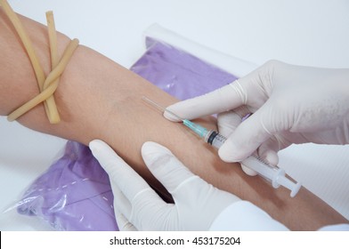 Medical Technologist Doing A Blood Draw