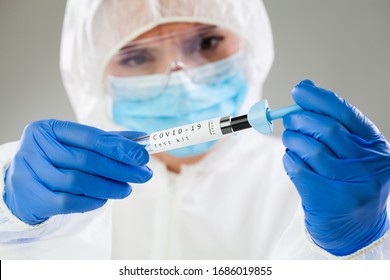 Medical technologist inspecting quick antigen test kit,COVID-19 virus disease rapid rt-PCR DNA enzyme analysis,Coronavirus global pandemic outbreak,patient antibodies testing procedure,clinical trial 
