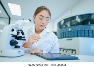 Medical technologist validating automated analyzer results against microscopic observations. Biomedical engineer configuring diagnostic instrument parameters using digital control interface.