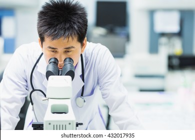 medical technologist is working in the laboratory. Using a microscope for detect the objects that are too small for the naked eye. Picture for concept such as hospital, doctor, health and science.