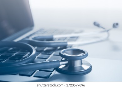 Medical Technology Background, Close Of Doctor's Stethoscope And Laptop Computer On Office Desk With Reflection, Black And White.  Online Health, Telemedicine Concept