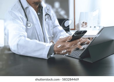 Medical Technology Concept. Doctor Working With Smart Phone And Stethoscope And Digital Tablet Computer In Modern Office At Hospital With Virtual Digital Graphic Icons Diagram