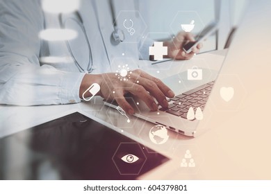 Medical Technology Concept. Doctor Working With Smart Phone And Stethoscope And Digital Tablet Computer In Modern Office At Hospital With Computer Interface Icons Diagram