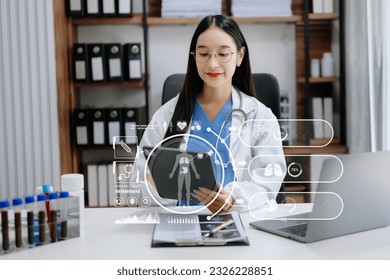 medical technology concept,smart Asian doctor hand working with modern laptop computer with his team virtual icon diagram.  - Powered by Shutterstock