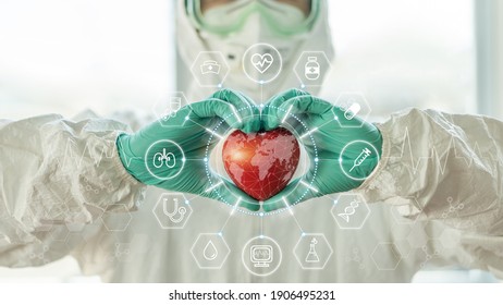 Medical technology, global health tech and world heart health day concept with cardiologist doctor in ppe for covid-19 protection in hospital cardiac cath lab for coronary laboratory science research