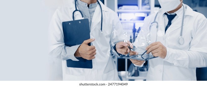 Medical technology and Healthcare concept, Two doctor working with tablet in room at the hospital. - Powered by Shutterstock