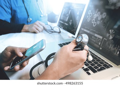 Medical Technology Network Team Meeting Concept. Doctor Hand Working Smart Phone Modern Digital Tablet Laptop Computer Graphics Chart Interface, Sun Flare Effect Photo                               