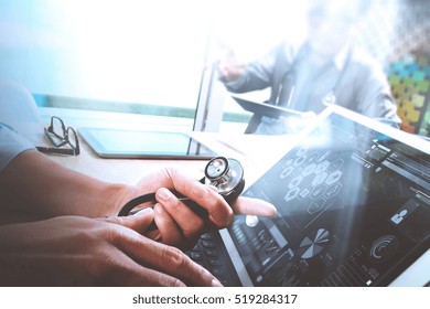 Medical Technology Network Team Meeting Concept. Doctor Hand Working Smart Phone Keyboard Docking Digital Tablet Screen Laptop Computer.sun Flare Effect