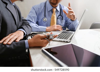 Medical Technology Network Team Meeting Concept. Doctor Hand Working Smart Phone Modern Digital Tablet Laptop Computer Graphics Chart Interface, Sun Flare Effect Photo