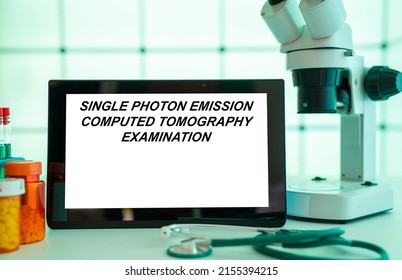 Medical Tests And Diagnostic Procedures Concept. Text On Display In Lab Single Photon Emission Computed Tomography Examination