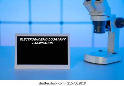 Medical tests and diagnostic procedures concept. Text on display in lab Electroencephalography Examination