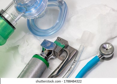 Medical Tools For Neonatal Reanimation, Face Ventilation Mask And Bag, Laryngoscope, Oral Tube And, Infant Stethoscope On White.